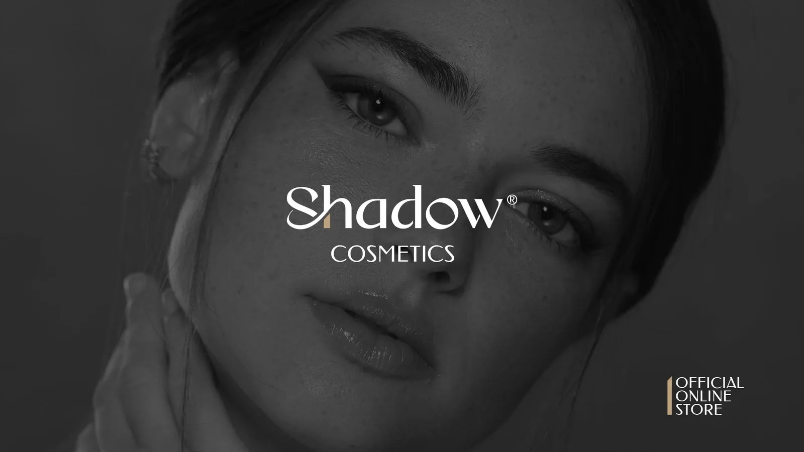Shadow Cosmetics campaign visual — monochrome portrait behind the white logotype