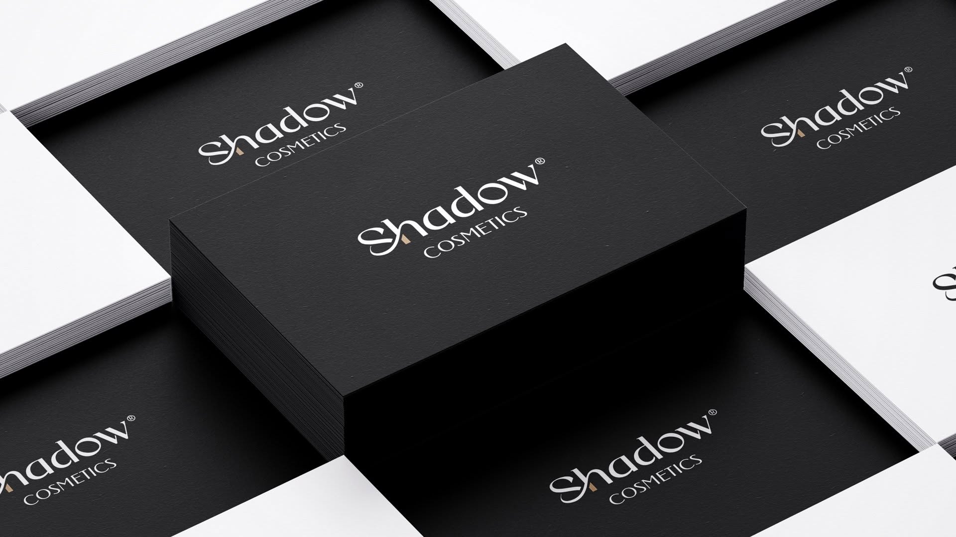 Shadow Cosmetics business cards — noir and ivory duplex stacks